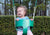 Child laughing while swinging in bucket swing by Gorilla Playsets. Child laughing while swinging in bucket swing by Gorilla Playsets.