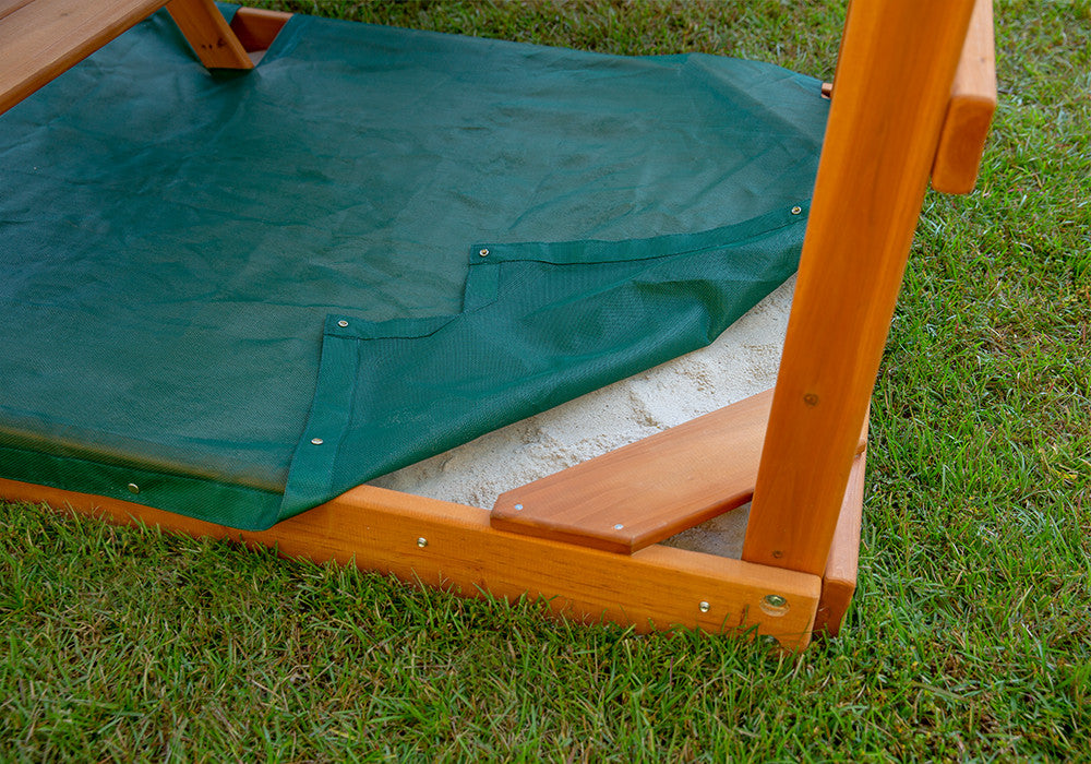 Outdoor shot of  Green Sandbox Cover from Gorilla Playsets.