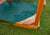 Outdoor shot of  Green Sandbox Cover from Gorilla Playsets.