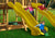 Lifestyle shot of Yellow Super Wave Scoop Slide from Gorilla Playsets