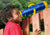 Boy looking through the blue and yellow Telescope w/ Compass  from Gorilla Playsets.